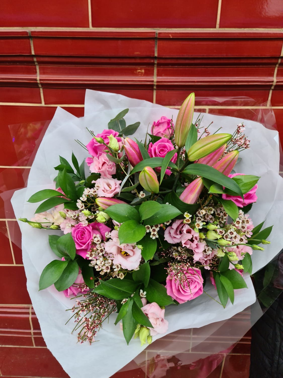 pink lilies with pink roses,eustoma and seasonal foliage Gilding the Lily
